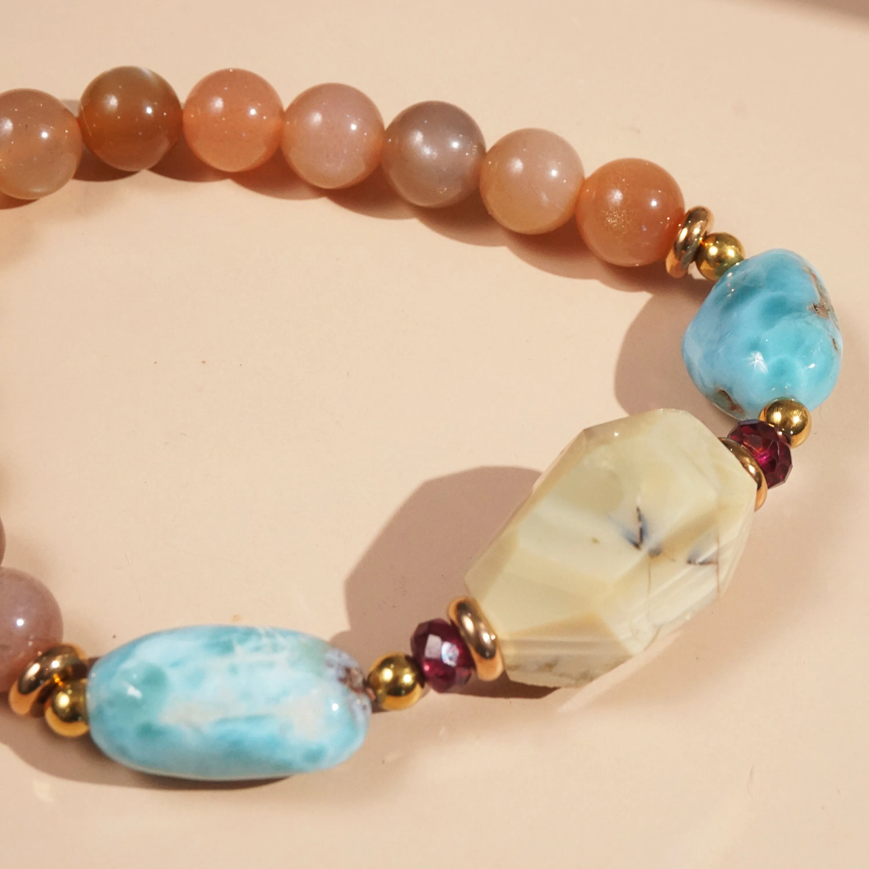Ivory Opal, Peach Moonstone, Larimar, and Garnet