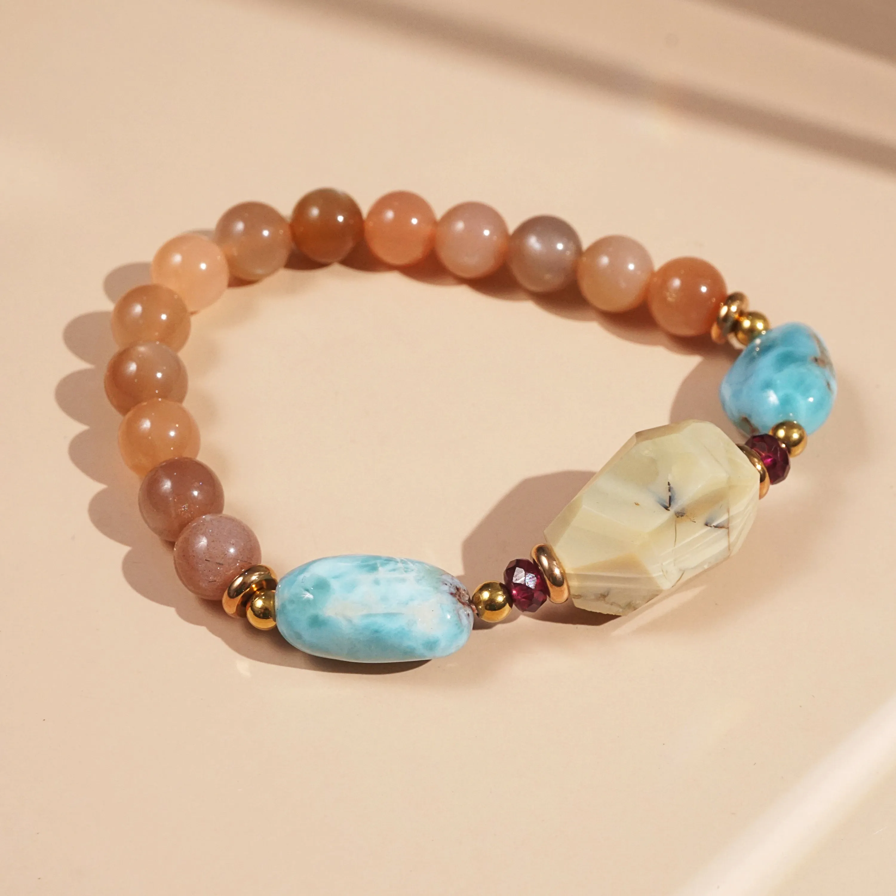Ivory Opal, Peach Moonstone, Larimar, and Garnet