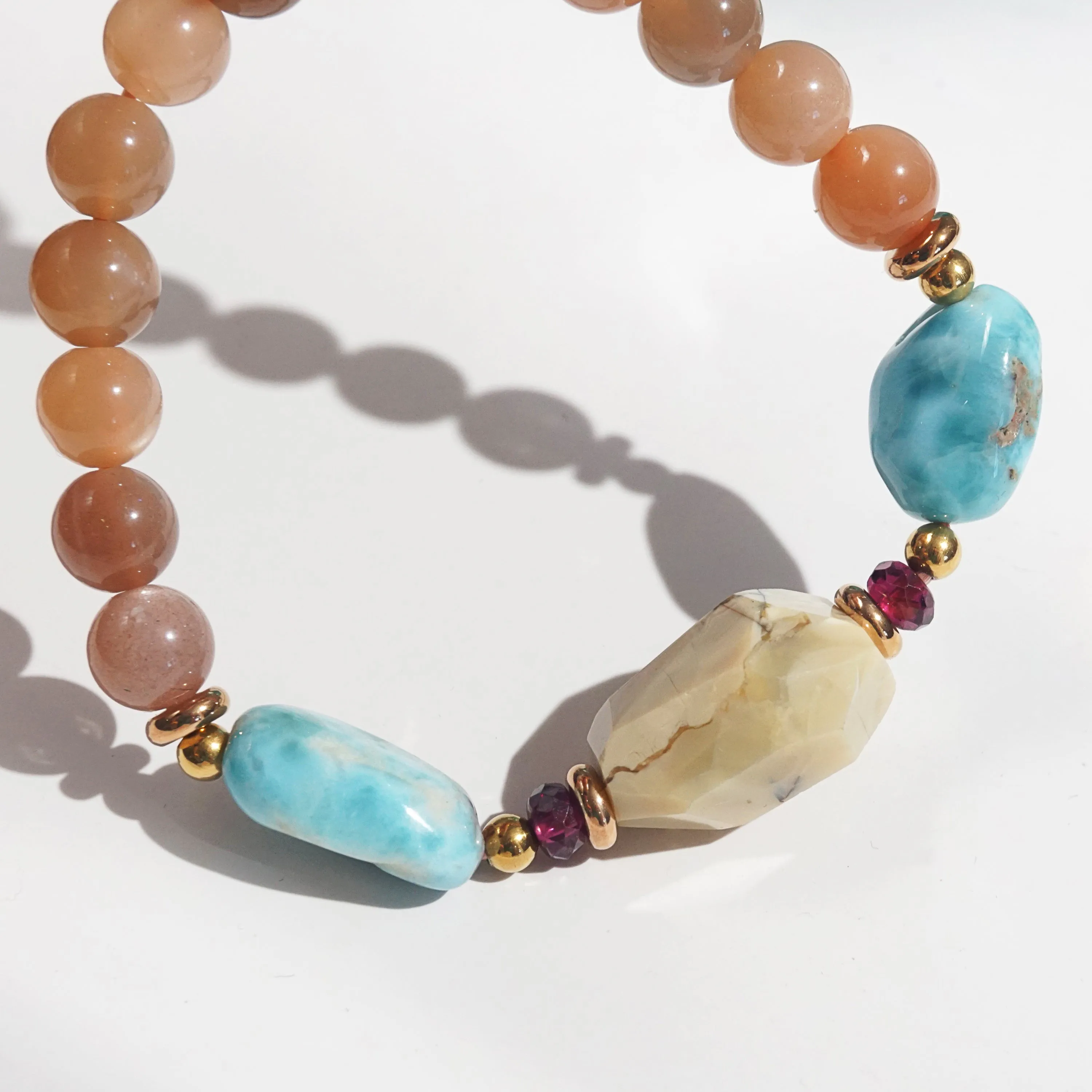 Ivory Opal, Peach Moonstone, Larimar, and Garnet